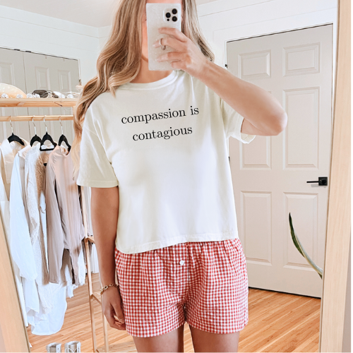 Compassion is contagious cropped tee