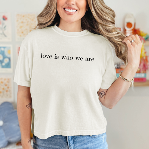 Love is who we are cropped tee