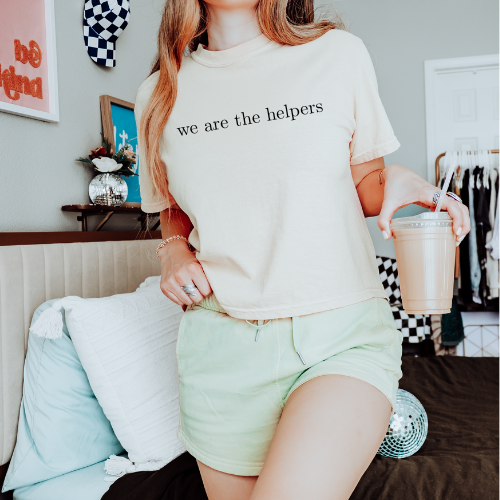 We are the helpers cropped tee